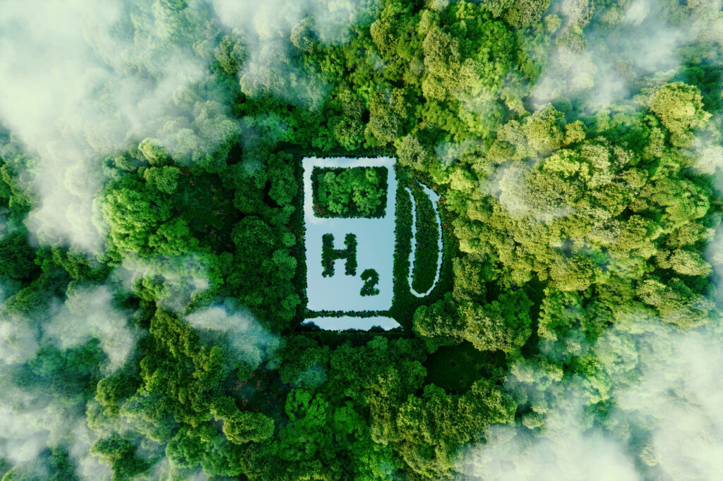 A lake in the shape of a hydrogen filling station used as a concept to illustrate the environmental friendliness of hydrogen and its potential as the fuel of the future 3d rendering Depositphotos
