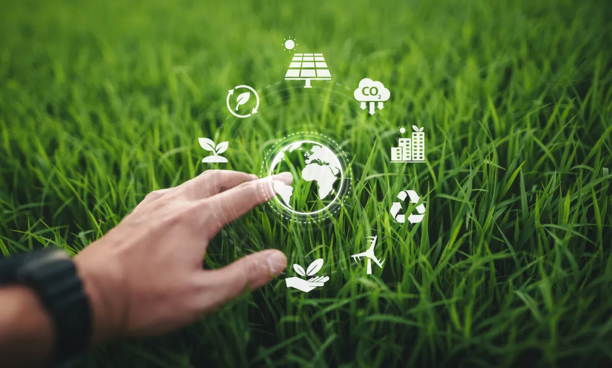 ESG environment conceptHand touching globe icon in natural gras Depositphotos