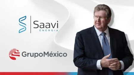 Businessman in a dark suit stands beside Saavi Energía and Grupo México logos on a light abstract background.