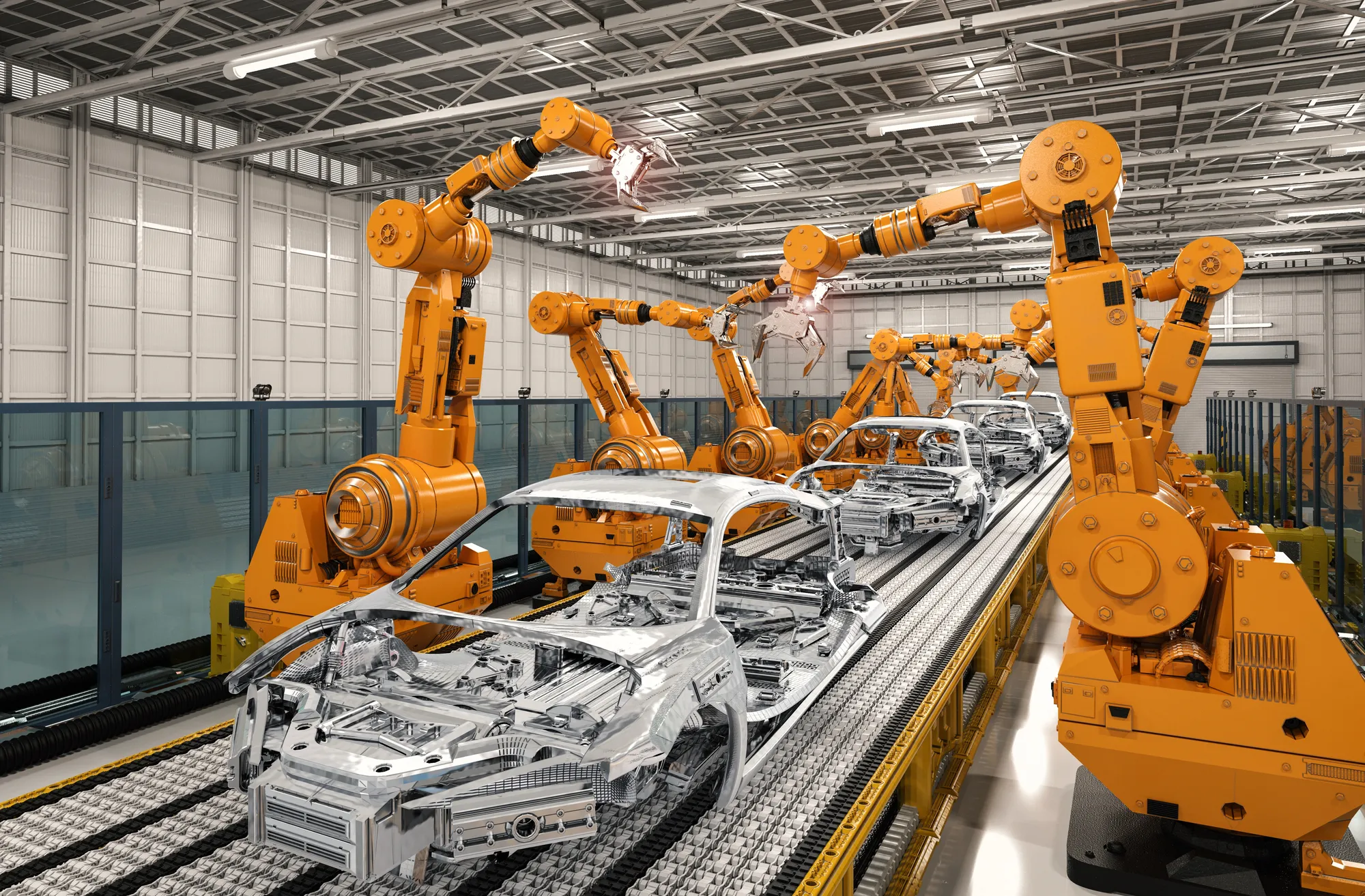 Orange industrial robots assemble car bodies on an automotive production line in a factory setting.