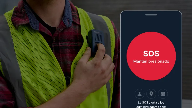 Worker in a high‑visibility vest presses a handheld device beside a smartphone showing a red SOS alert.