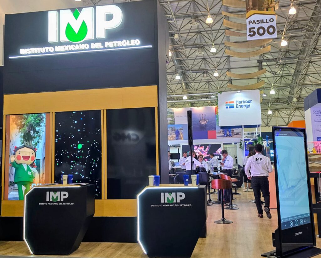 CMP Stands 2 - Petróleo y Energía IMP booth at a trade show: large black and yellow display with the IMP logo and two podiums at the front.