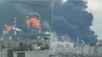 Split-screen view of an industrial facility on fire with bright flames and thick smoke rising above city buildings nearby.