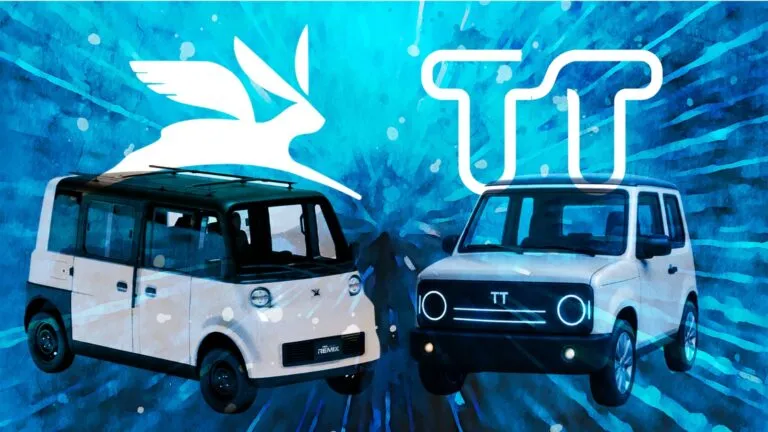 Two white vans facing each other against a blue abstract background with a large white bird silhouette and bold white TT lettering above them.