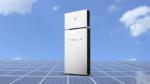Tall white Tesla battery unit standing upright on a vast solar farm under a blue sky with clouds