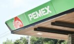 PEMEX logo and name on a green gas station canopy.