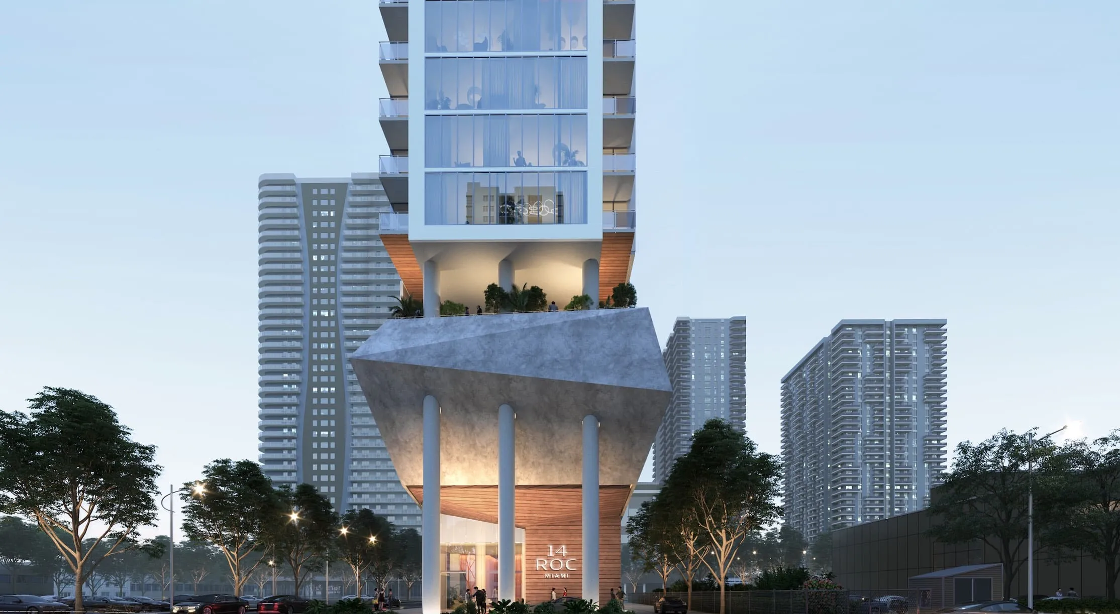 Futuristic glass-clad tower rising from a sculpted concrete podium, with trees and other high-rises nearby at dusk.