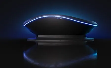 Sleek gaming mouse with a blue LED rim, resting on a pedestal against a dark background.