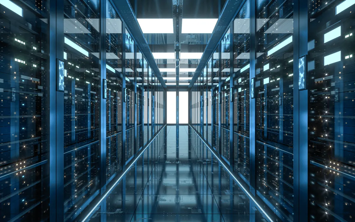 Data center corridor with rows of blue-lit server racks and a reflective floor extending to a bright double door at the end.