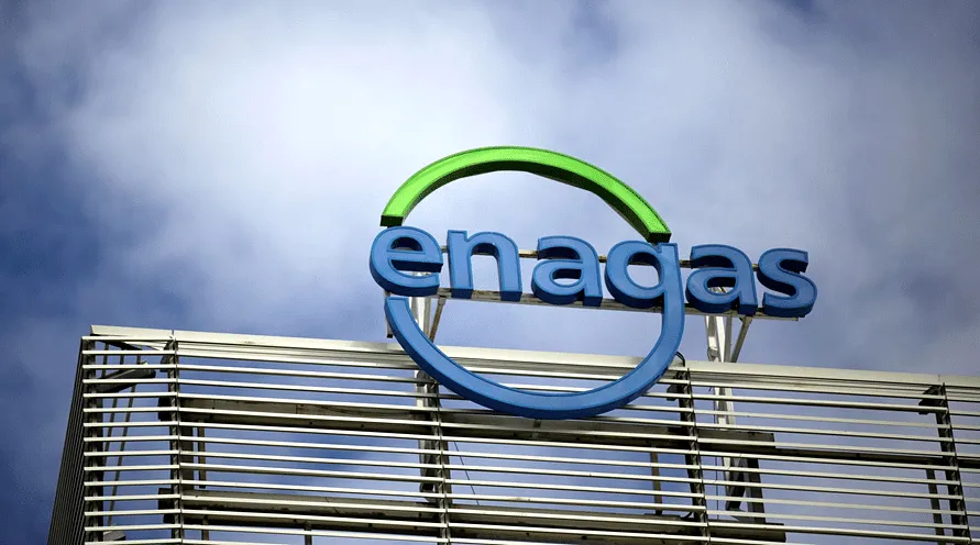 Enagás corporate logo with blue letters and a green arc above, mounted on a building facade