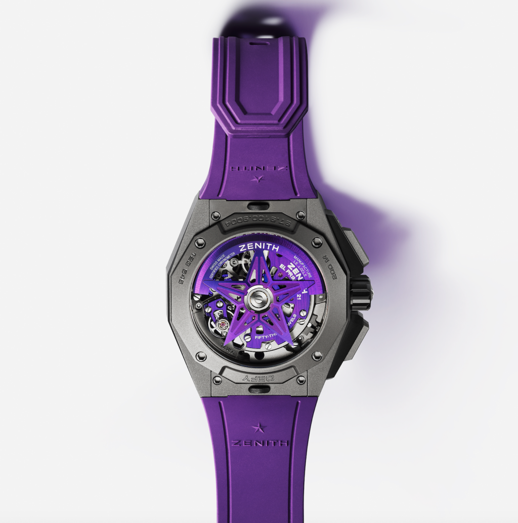 zenith_ultraviolet 3 - Petróleo y Energía Purple Zenith wristwatch with a skeleton dial and gray case, purple strap extending upward.