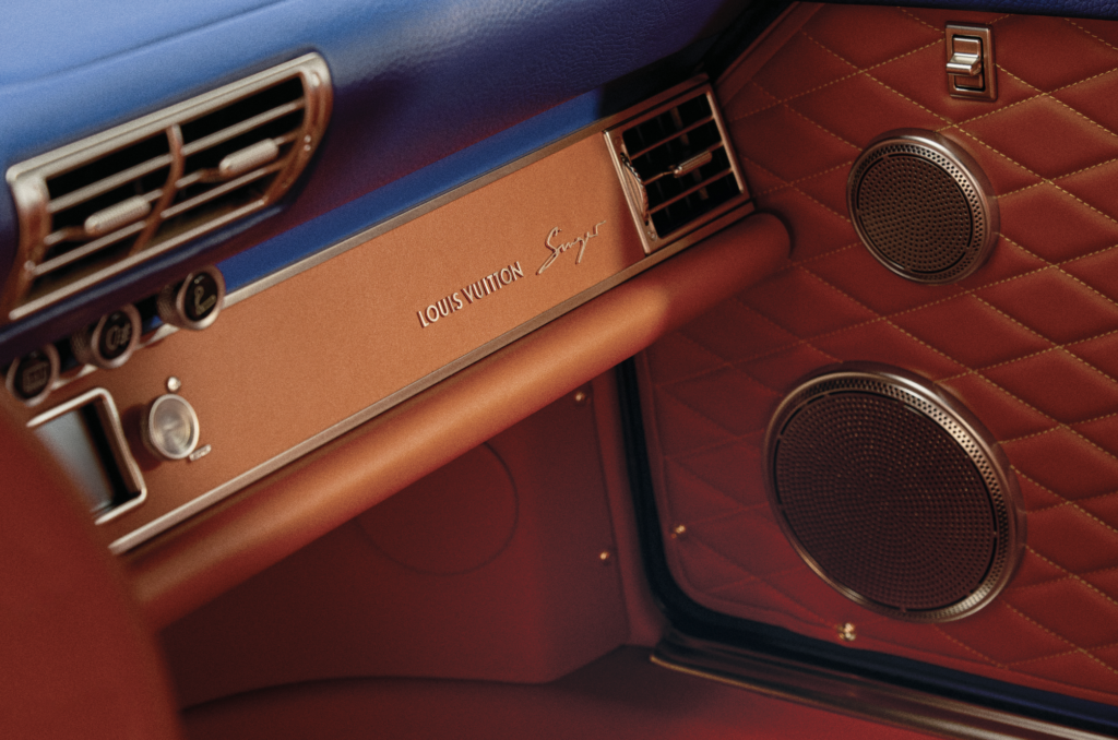 - Petróleo y Energía Louis Vuitton branded dashboard in a luxury car, with blue upper panel and red quilted leather interior.