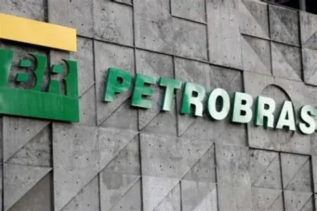 Petrobras logo on a gray concrete building facade; green letters spell 'PETROBRAS' with a yellow block to the left.