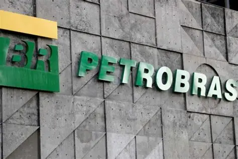 Petrobras logo on a gray concrete building facade; green letters spell 'PETROBRAS' with a yellow block to the left.