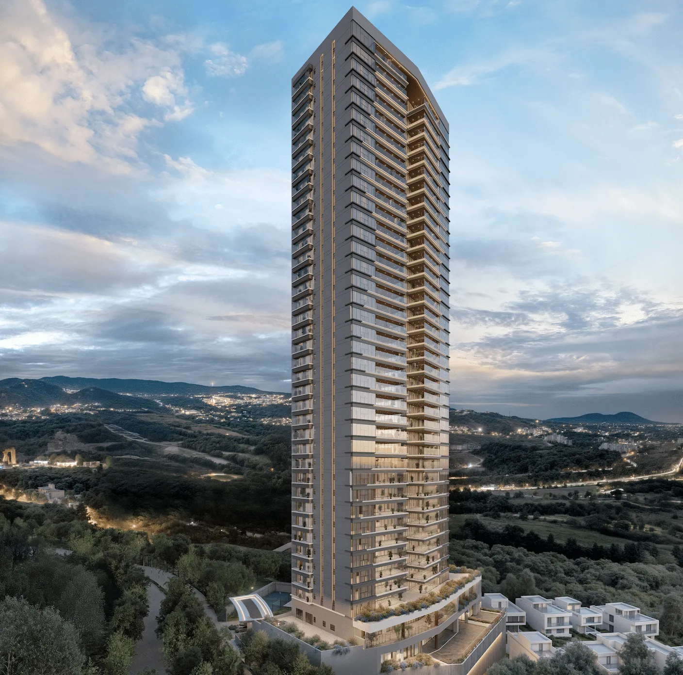Tall, modern glass high-rise apartment tower rises above a wooded landscape against a blue sky at dusk, with many balconies visible on every floor.
