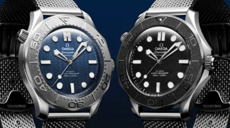 Two Omega Seamaster dive watches shown side by side, blue and black dials against a dark background.