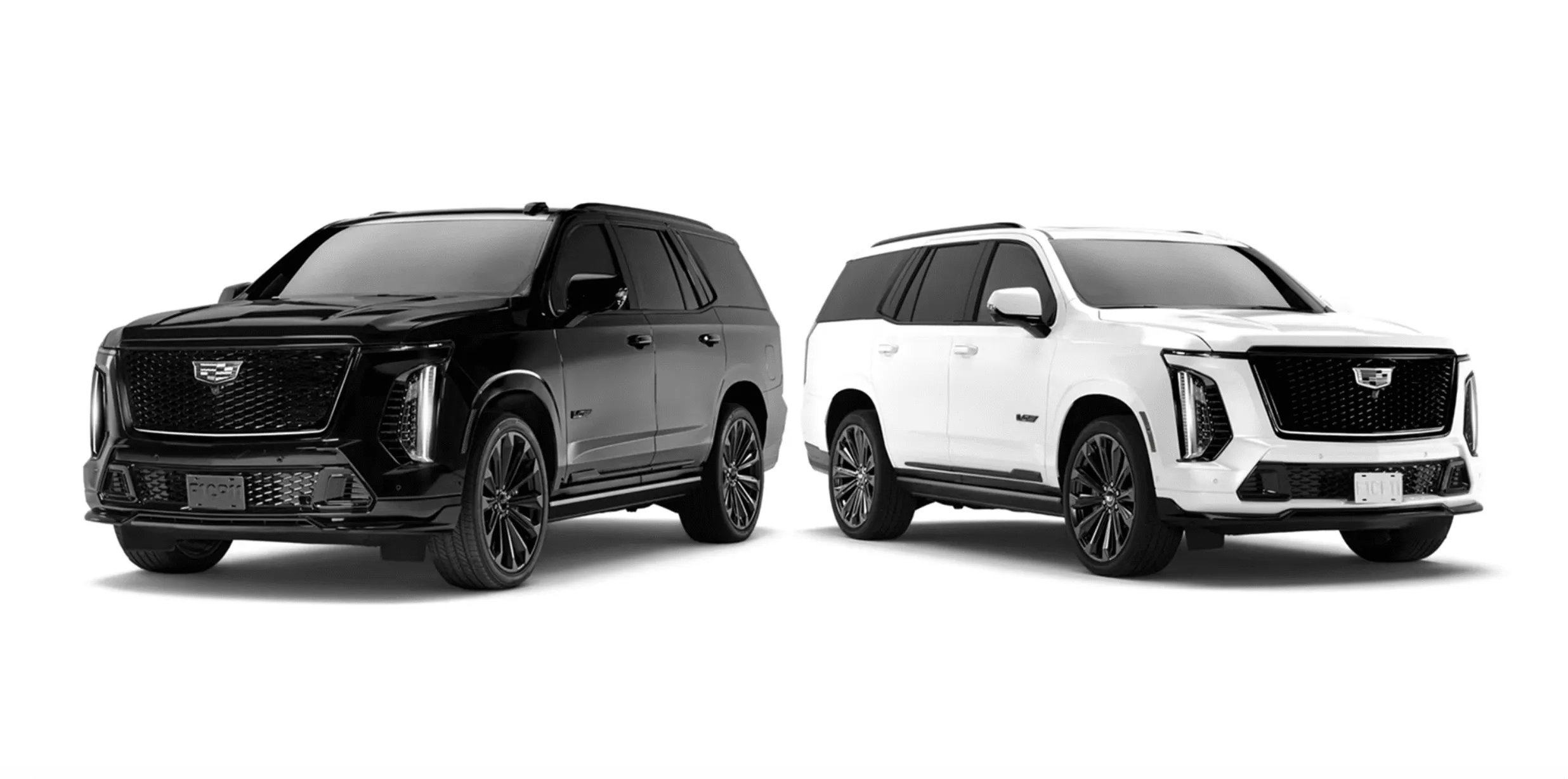 Two Cadillac Escalade SUVs—one black and one white—parked side by side in a neutral setting with large grilles and chrome accents.