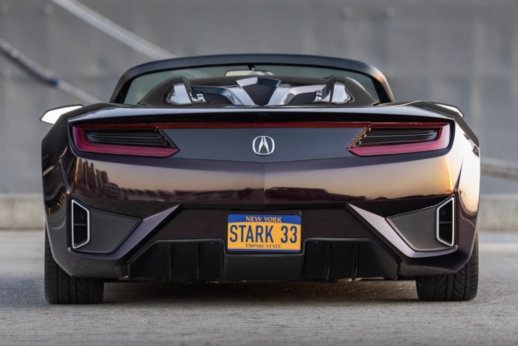 acura the avengers - Petróleo y Energía Rear view of a dark convertible with Acura emblem and a New York license plate reading'STARK 33'