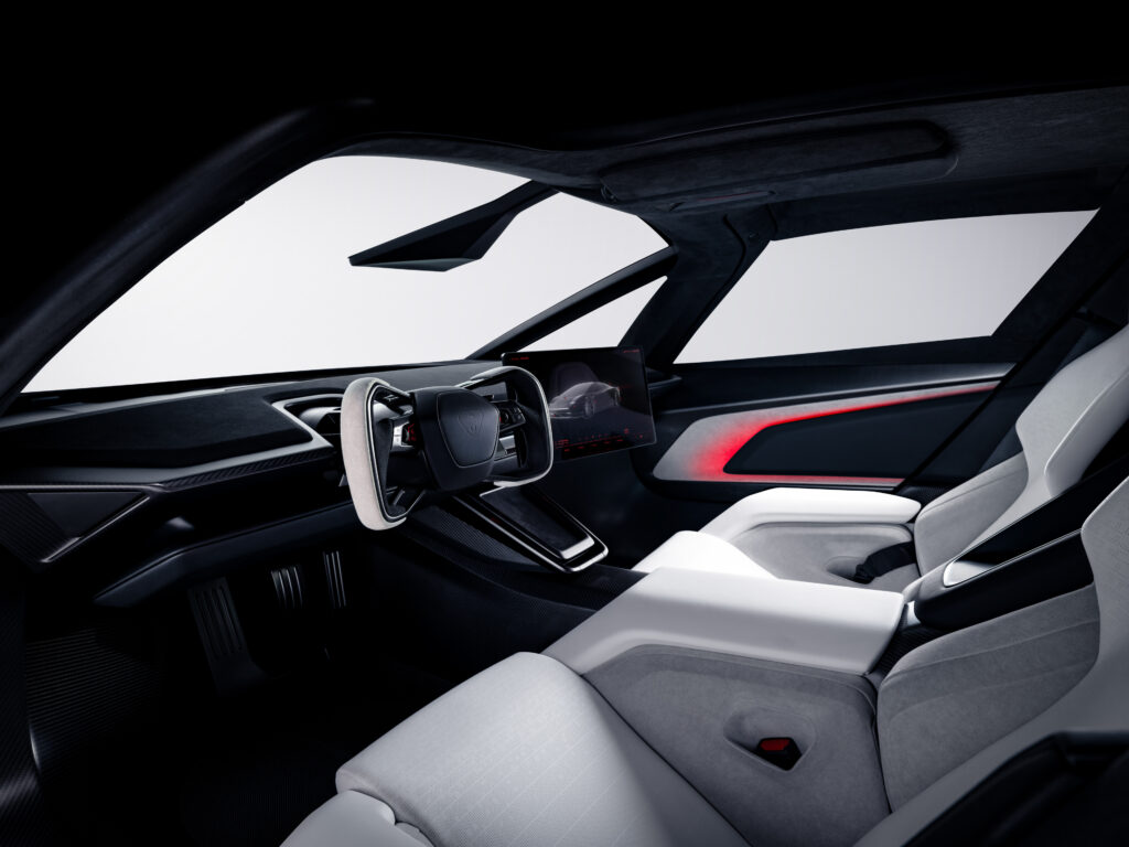 Roadster_67 - Petróleo y Energía Modern car interior with a minimalist digital dashboard and steering wheel, red ambient lighting, and stitched white seats viewed from the passenger side.